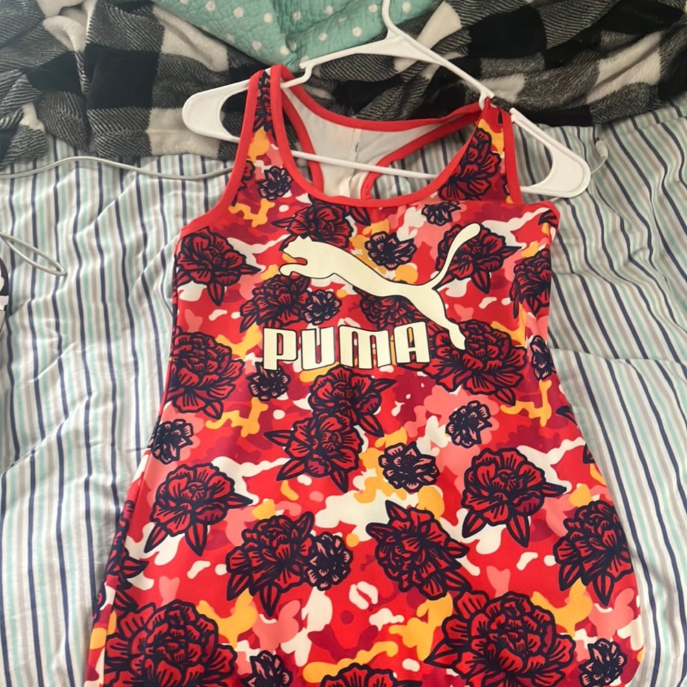 Size is a small it is gently worn. It has two slits on the sides.